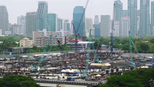 Panoramic view of cityscape and construction site in metropolis