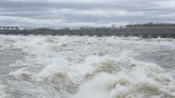 Flood waters race through Chaudiere Falls spillway from power dam.