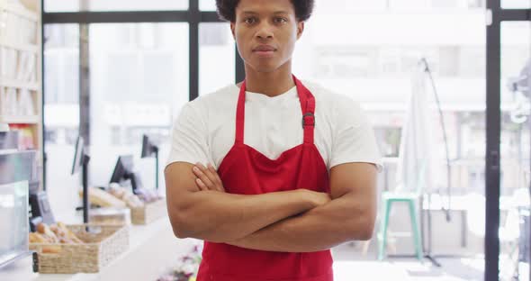 Animation of happy biracial waiter standing in coffee shop