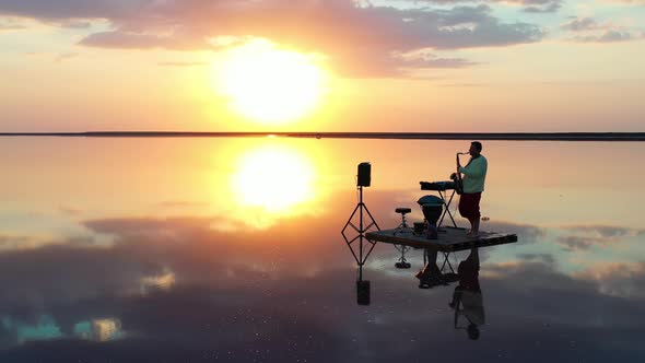 Saxophonist Is Playing on a Small Raft in the Sea, Reflections of the Sky, 