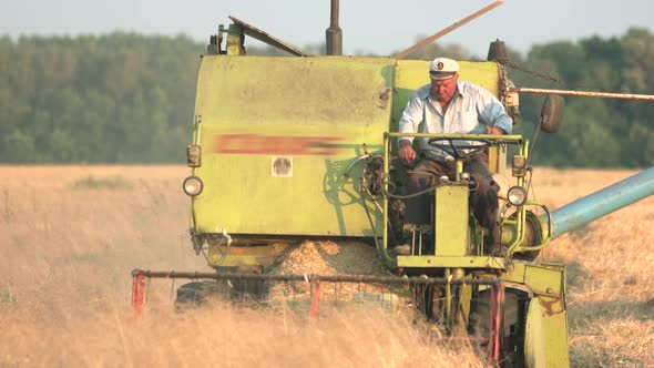 Man Driving Combine.