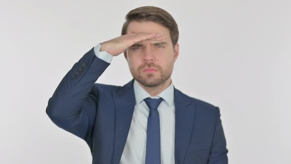 Young Businessman Looking Around, Searching White Screen