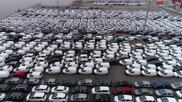 Motion Over Rows of Finished Cars at Open Warehouse Lot