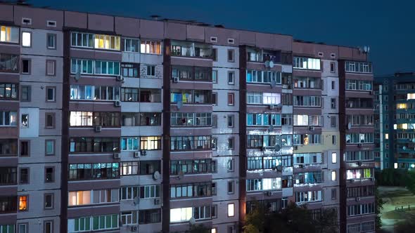 Multistorey Building with Changing Window Lighting At Night. Timelapse