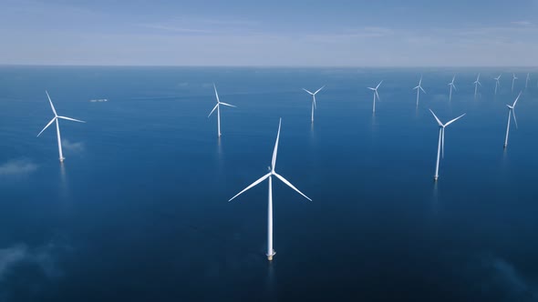 Offshore Windmill Park with Clouds and a Blue Sky Windmill Park in the Ocean Drone Aerial View with