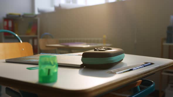 School Supplies on Desk in Classroom