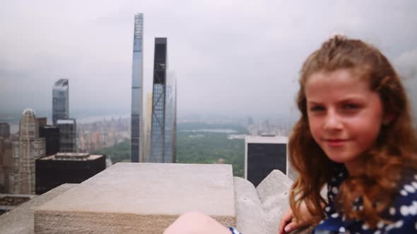 Girl Sitting On Skyscraper Roof Over New York Cityscape