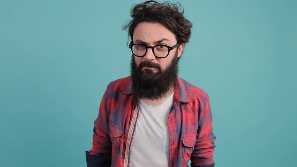 Close Up of a Bearded Man Saying Hi and Smiling, Welcoming Friends with Hand.