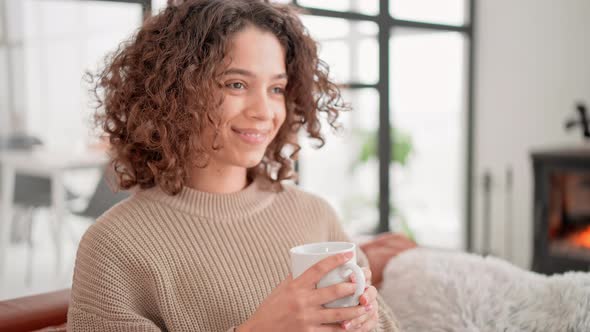 Brunette Holding Cup Relish Drink Indoors