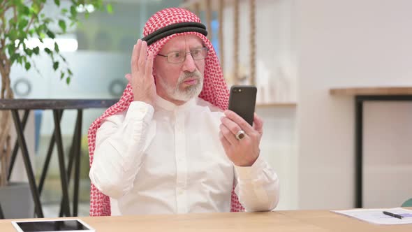 Senior Old Arab Businessman Having Failure on Smartphone