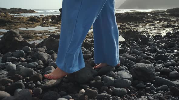 Two Beautiful Woman Walk Along the Volcanic Beach of Tenerife