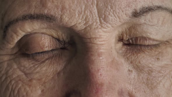 Eyes of Senior Woman Looks at Camera