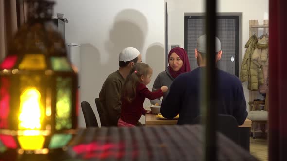 An Authentic Muslim Family Has Dinner Together at Home in the Evening