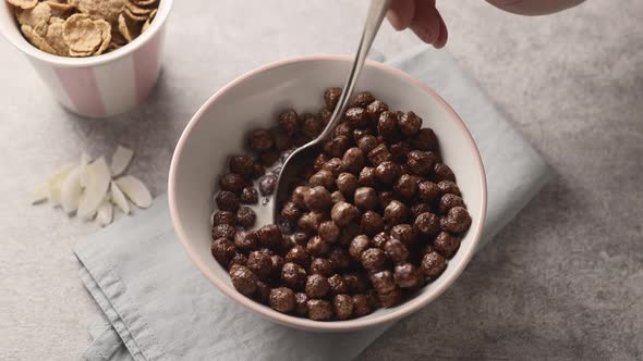 Dry chocolate cereal breakfast in a white bowl