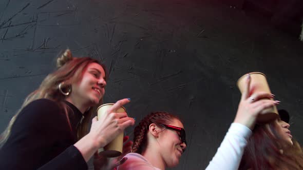 Happy Carefree Young Women Dancing and Having Fun at the Club