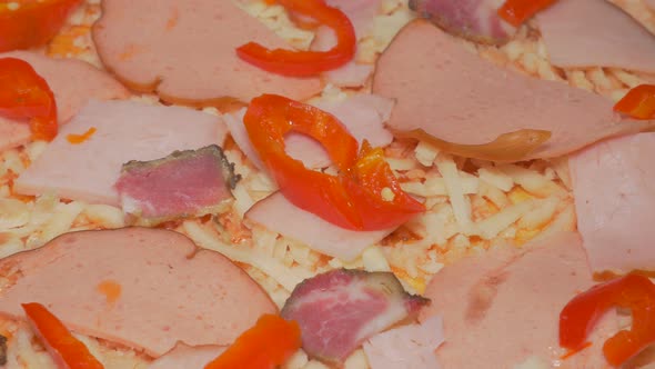 Pizza making phase with adding paprika slices  slices 4K 2160p UHD slow panning video - Pizza prepar