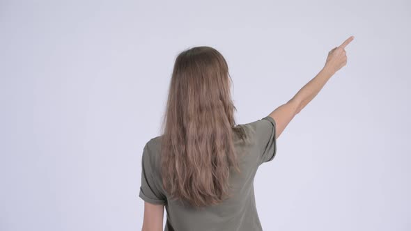 Rear View of Young Woman Thinking and Pointing Finger