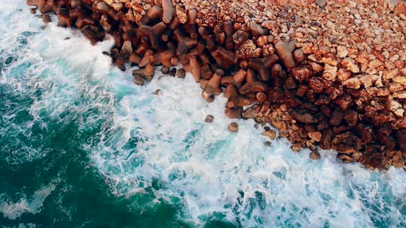 Blue Sea Beating Against Rocks