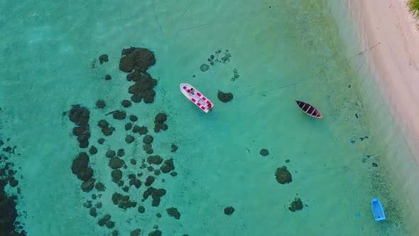 Aerial drone travel of tropical shore beach by blue water and sand background