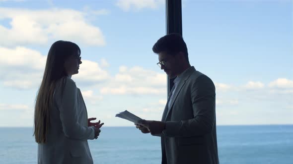 Divorced Couple Checking Papers at Attorney Office