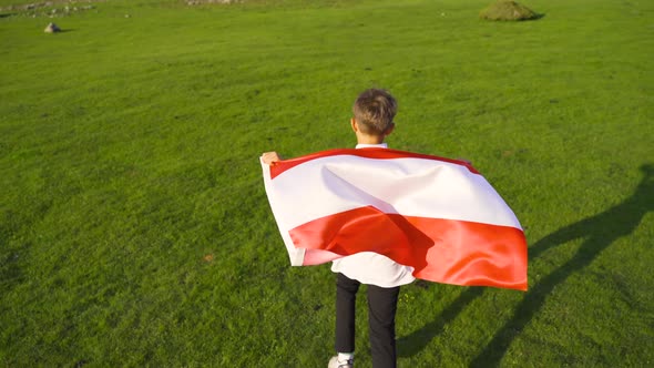 Boy waving the Austrian flag.