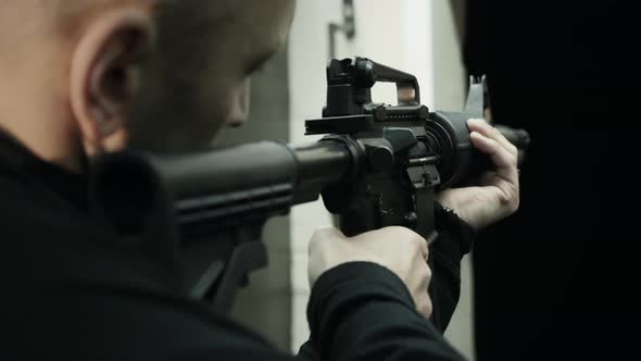 Military Soldier with a Carbine in His Hands