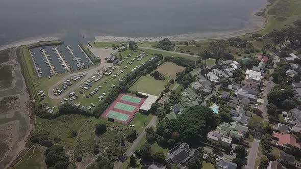 Leisure Island Marina, empty tennis courts in Knysna, S Africa aerial