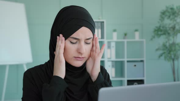 Tired Arabian Muslim Islamic Woman in Black Hijab Female Worker Student Take Short Pause in Online