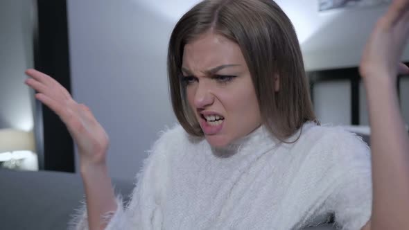 Shouting Angry Woman Sitting on Side of Bed