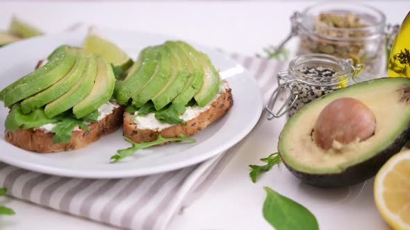 Healthy Breakfast or Snack  Soft Cheese and Avocado Sandwich on a Plate