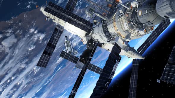 Space Station And Space Shuttle Orbiting Earth alt
