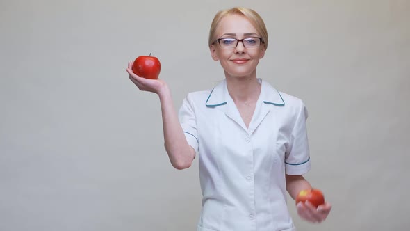 Nutritionist Doctor Healthy Lifestyle Concept - Holding Organic Red Apple