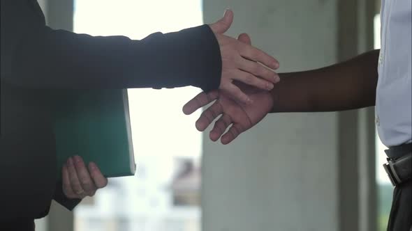 Afro-american Construction Business Man and Female Architect Handshake at Construction Site