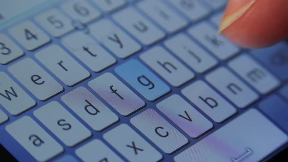 A Woman Types on a Smartphone - Closeup