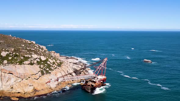 Aerial view of shipwreck crane barge is off the coast of Sandy Bay.