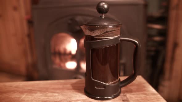 Coffee cafetiere brewing by fire