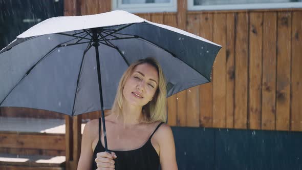 Attractive Blonde in the Summer Rain