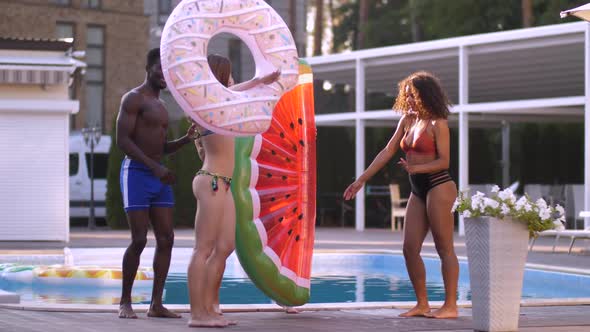 Cheerful Multinational Friends Dancing Near Pool