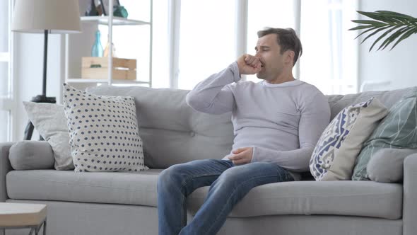 Coughing Sick Adult Man Sitting on Couch, Cough