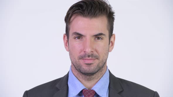 Head Shot of Young Happy Hispanic Businessman Smiling