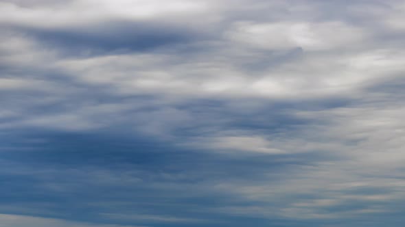 Fluffy White and Grey Clouds Moving Fast in Time-lapse. Idyllic Cloudy Heaven Background. Timelapse