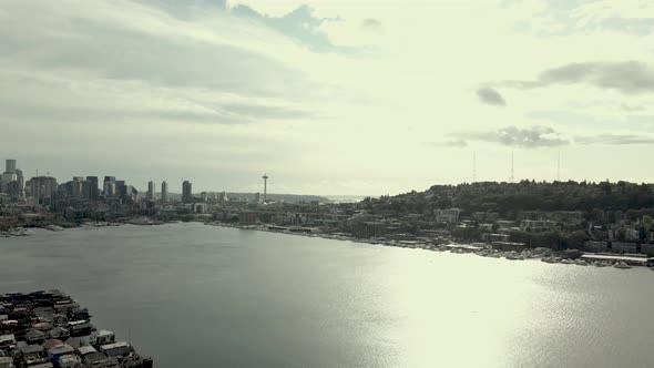 Bright sun blazing off Lake Union, Queen Ann Hill and downtown Seattle, aerial