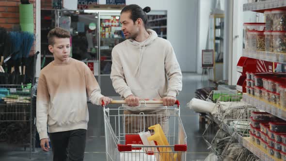 Father and Son Walking in Hardware Store