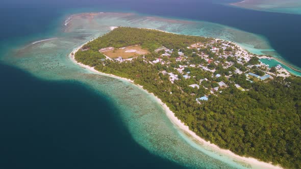 View from a height of a city located on a Maldivian island in the middle of the ocean with gorgeous