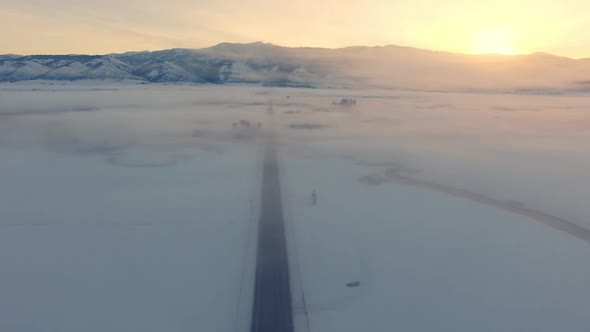 Aerial view over road in the Wyoming winter landscape