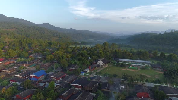 Flying over Village in Doi Inthanon at Sunrise