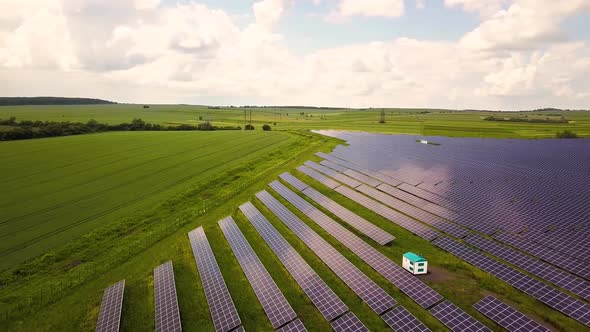 Aerial view of solar power plant field. Electrical photovoltaic panels for producing clean ecologic