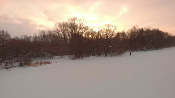 Sunset At The Frozen River