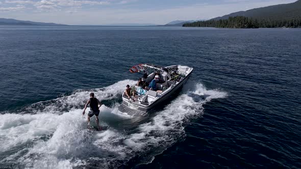 Active Man Wakeurfing In The Flathead Lake And Pulled By A Speedboat Near The Kalispell, Montana. Wa