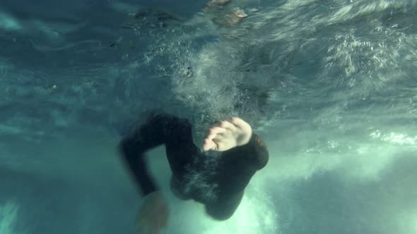 Underwater View Professional Triathlete Swim in Pool